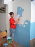 Simona organizes a workshop with all of the children, but in spare moments has become a painter